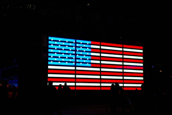 American Flag in Times Square at Night