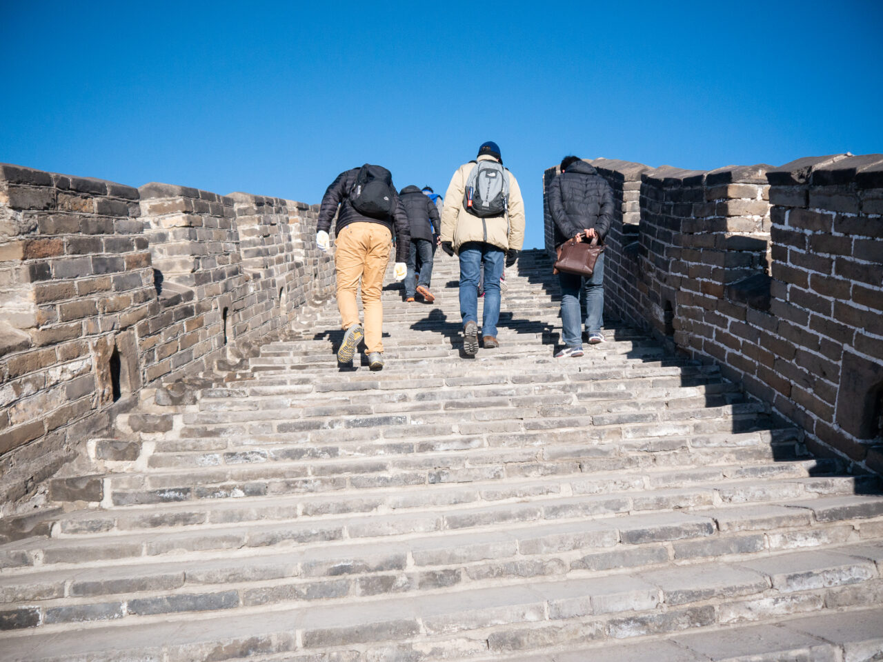 tourists walking on the great wall of china at mutianyu