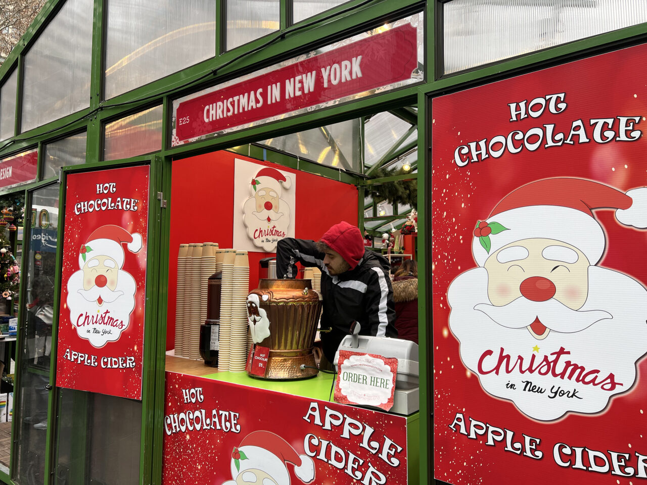 Man preparing hot chocolate at the Christmas in New York stall at Bryant Park Winter Market