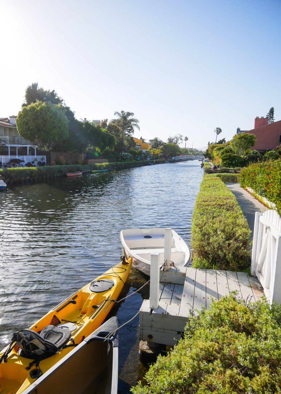 Kayak and small boat on the Venice Canals in Los Angeles