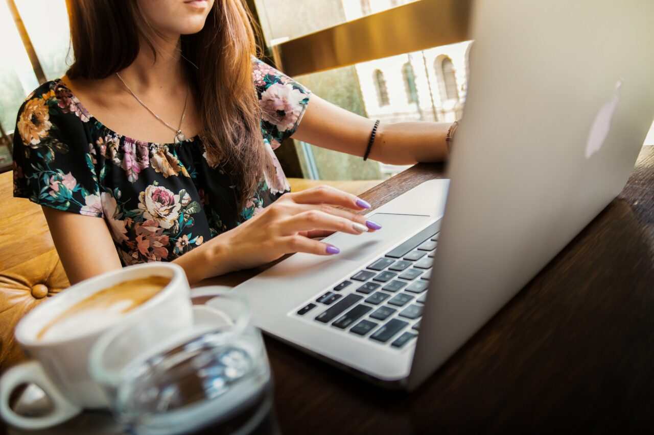Digital nomad typing on laptop