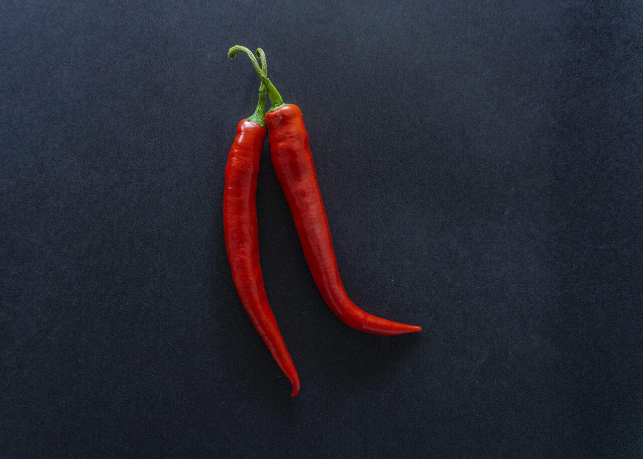 Chilli peppers on a black background