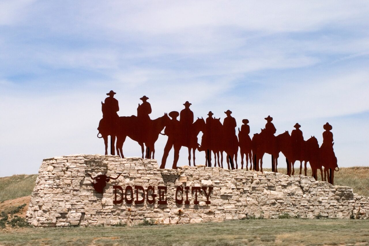 Dodge City, Kansas welcome sign of Cowboys in Silhouette