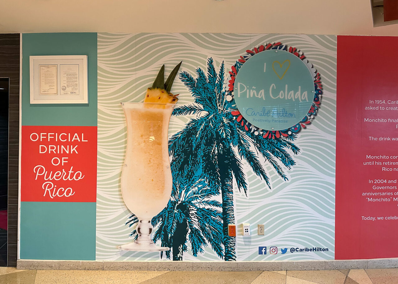 Pina Colada, official drink of Puerto Rico sign at the Caribe Hilton Hotel, San Juan