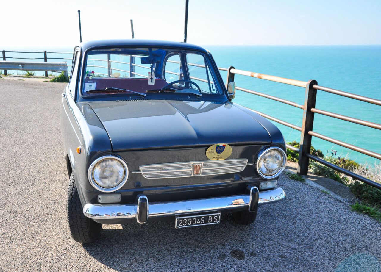 Classic Fiat on coastal road in Gargano Italy