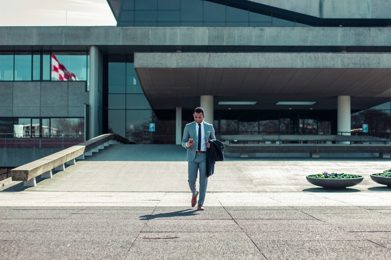 Businessman walking in front of a building