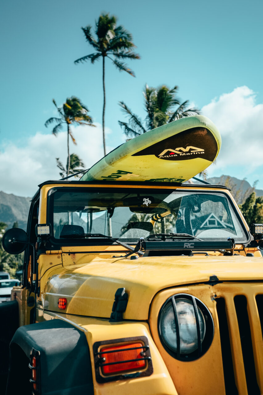 Vehicle with surf board on top