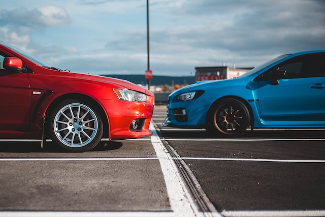Red and blue car in parking lot