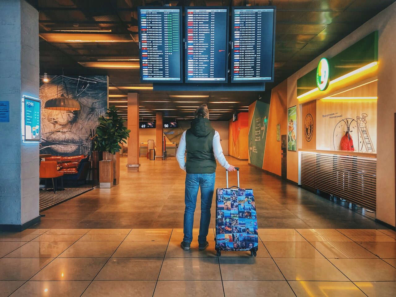 Man looking at departures board at the airport