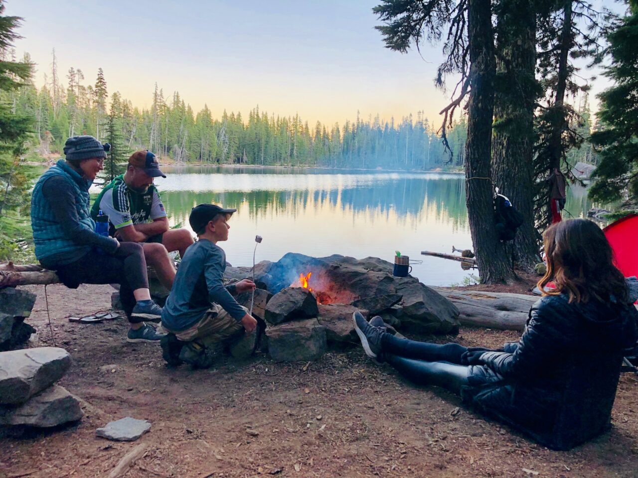 Family camping by a lake
