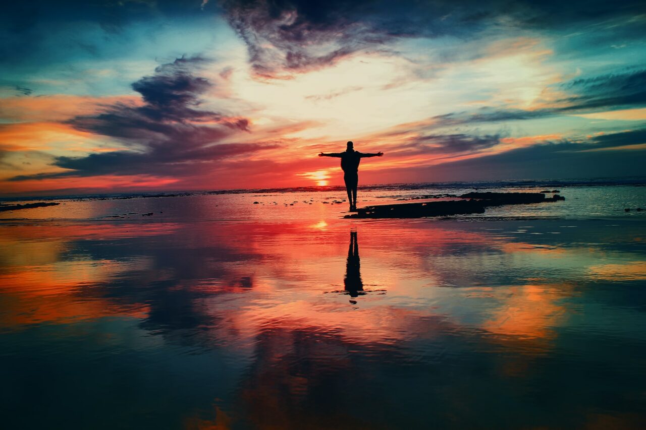 Person on the beach at sunset