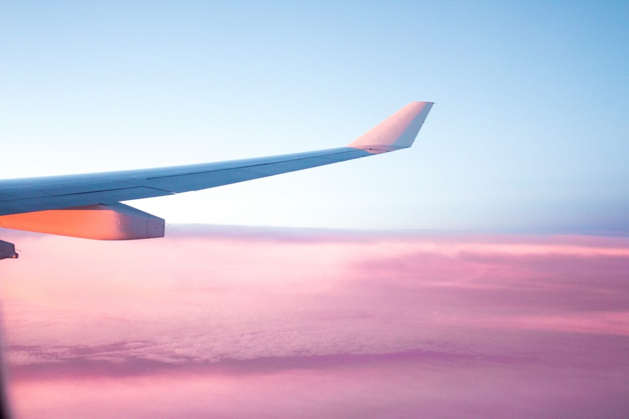 Plane wing at sunset