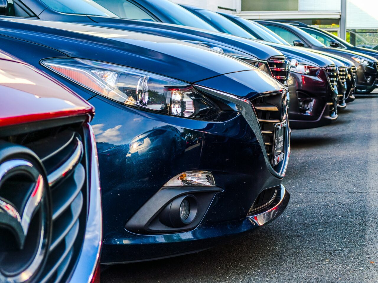 Row of Mazdas at a dealership