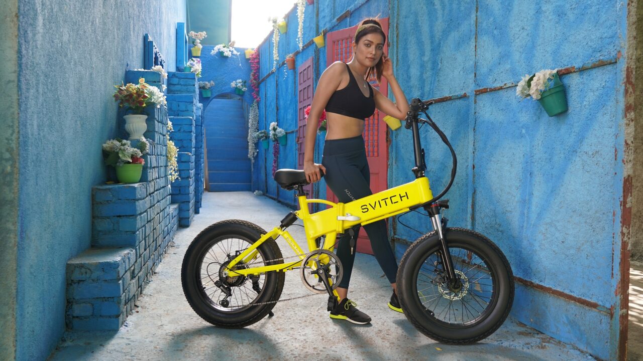 Woman standing with ebike