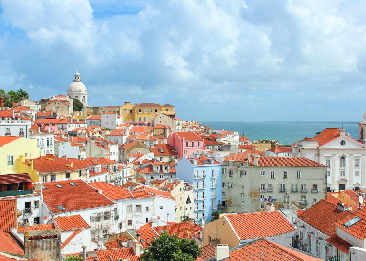 Terracotta rooftops and colorful buildings in Alfama, Lisbon