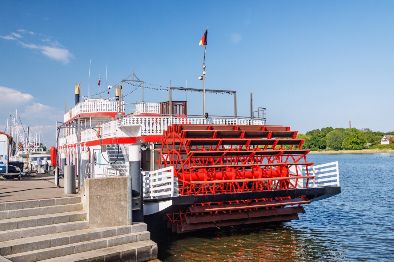 Red paddle steamer on a river