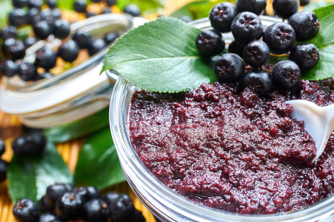 Chokeberry jam and ripe berries
