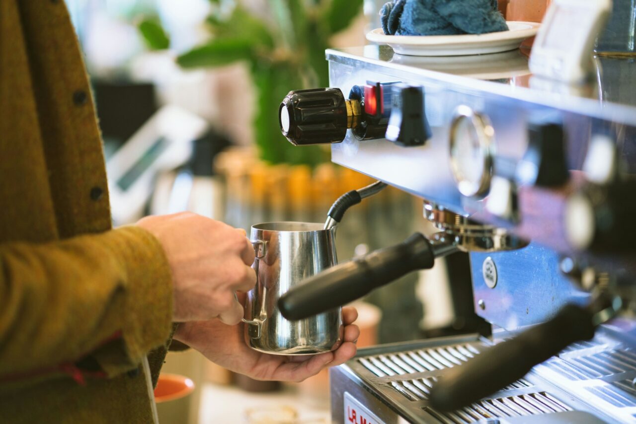 Close up of person making a coffee at a coffee shop in Bend, Oregon