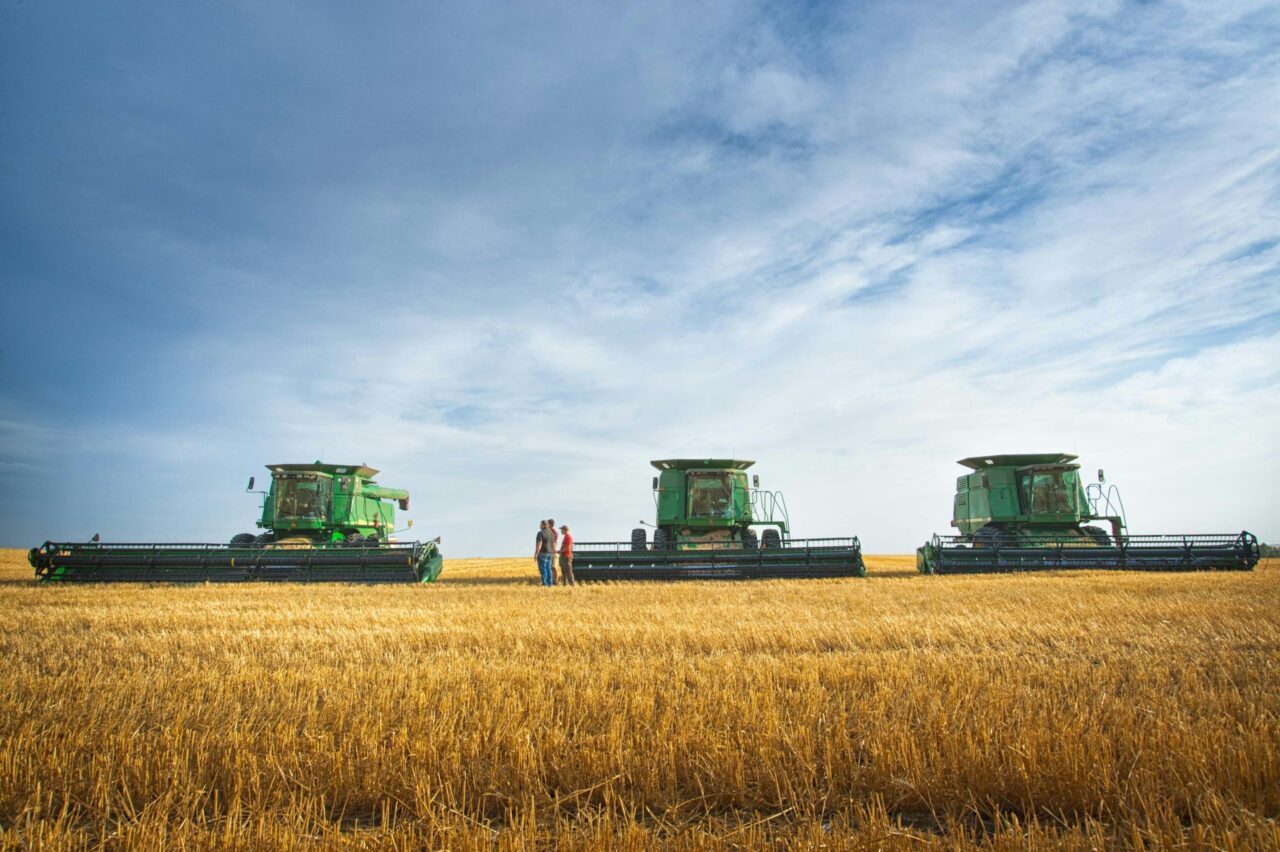 Deere combine harvesters in a field in North Dakota