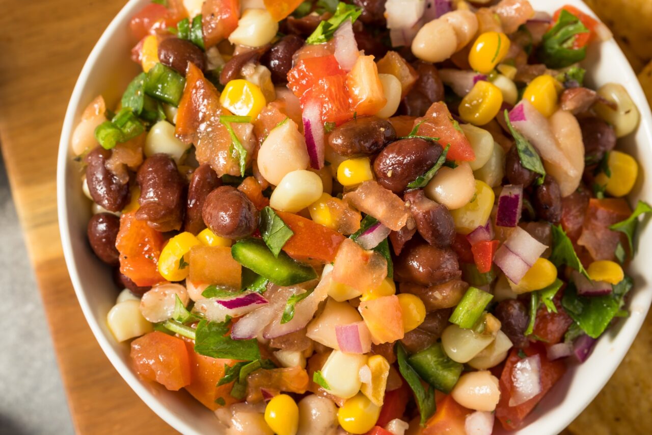 Bowl of Cowboy Caviar with corn, beans and tomatoes - a well known food Oklahoma is known for