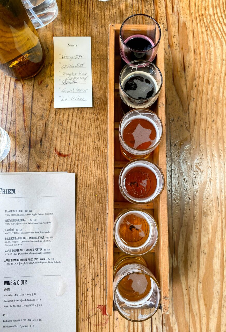 Beer tasting flight on a wooden table in Oregon