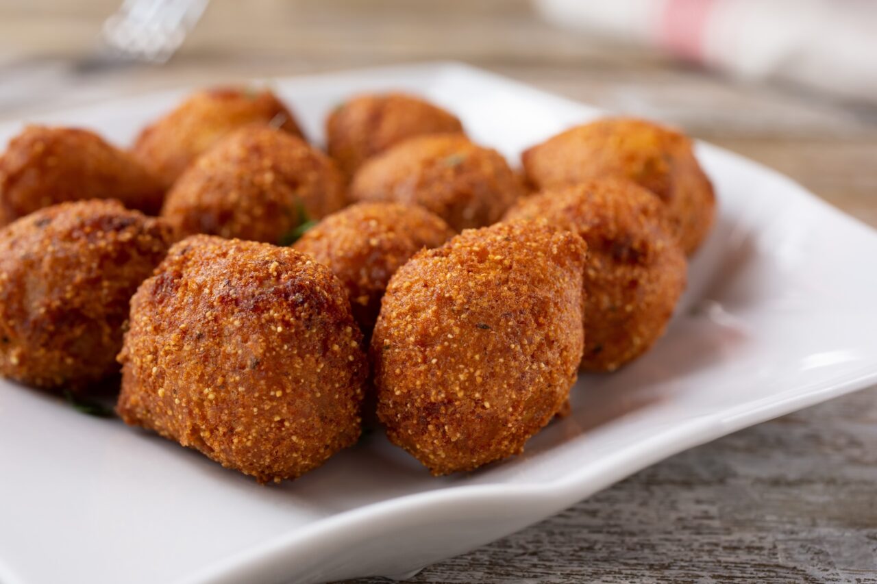 Plate of deep fried hush puppies