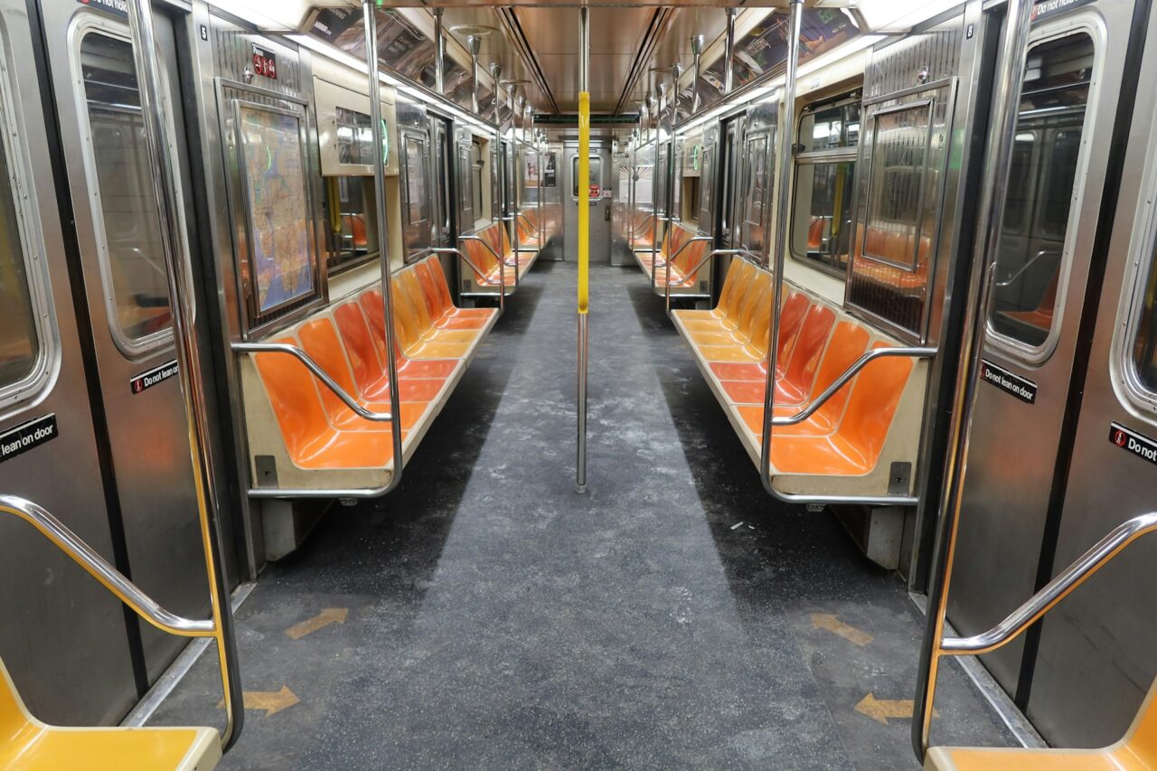 Empty subway car with orange seats in New York City