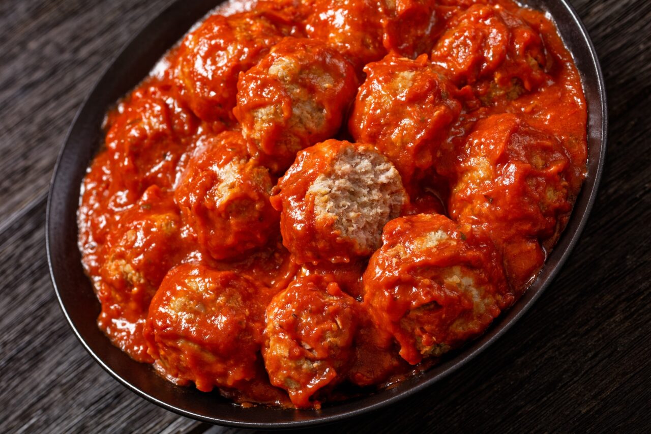 Iowa ham balls in tomato sauce in a bowl