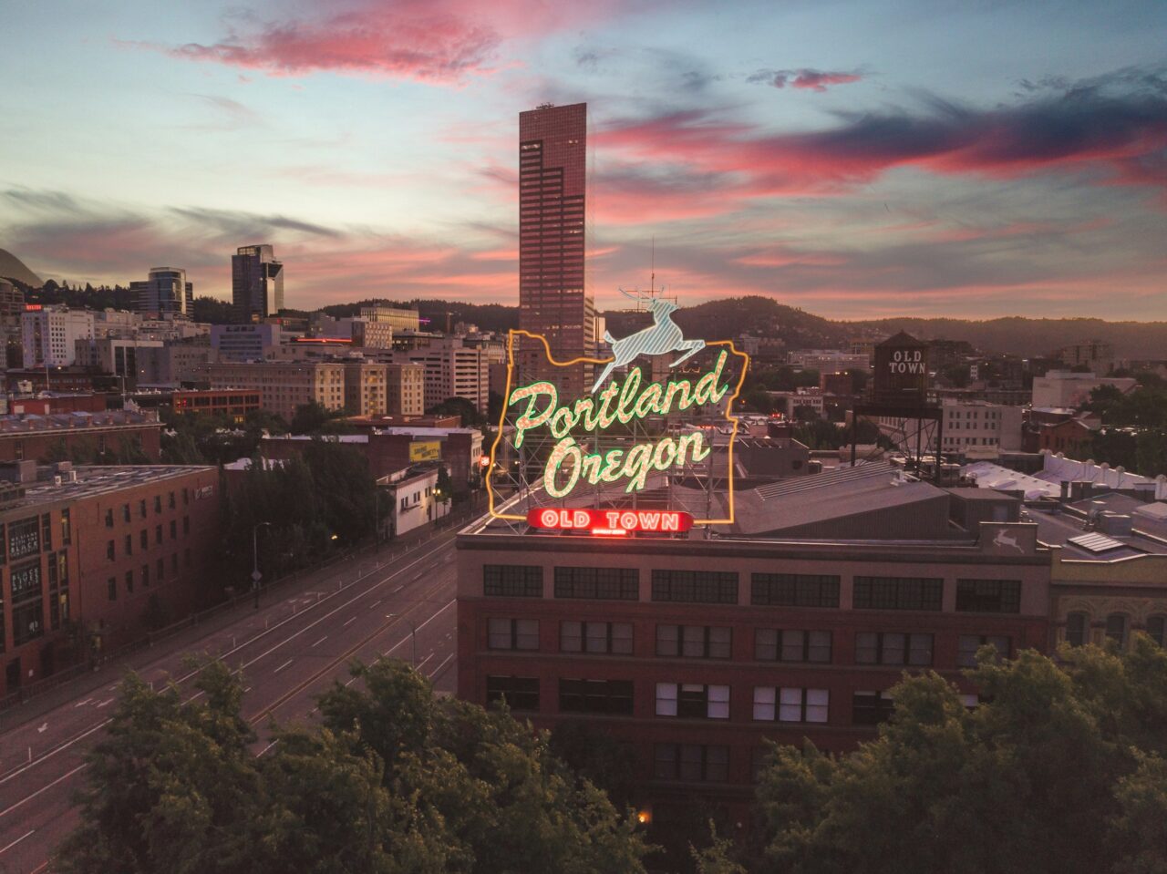 View of downtown Portland at sunset and the Portland Oregon sign