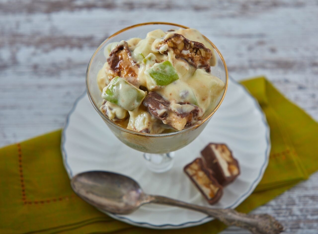 Snickers salad in a glass cup