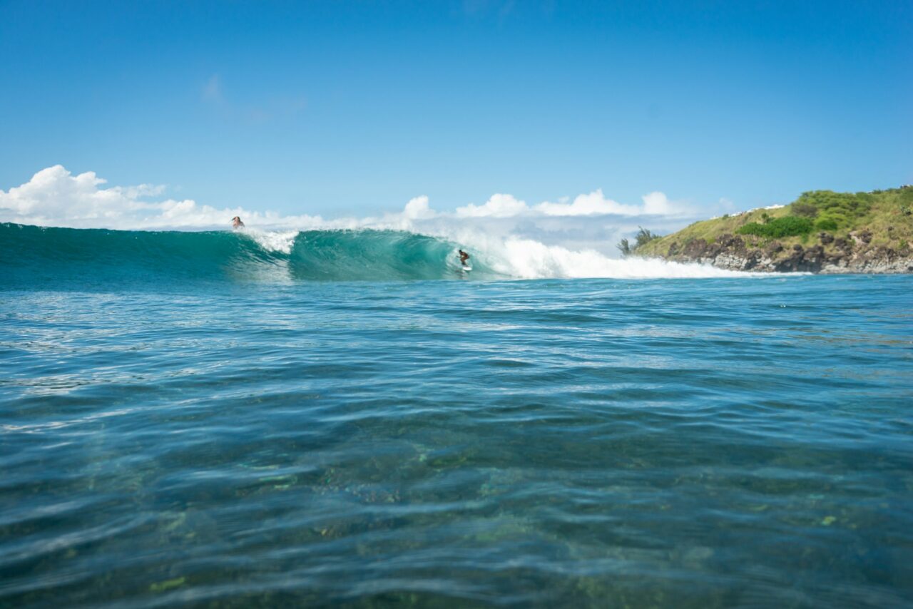 Surfer riding a wave in Honolua Bay, Hawaii