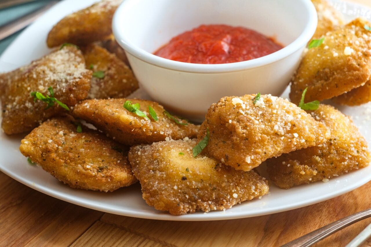 Breaded fried Italian ravioli with hot marinara tomato dipping sauce