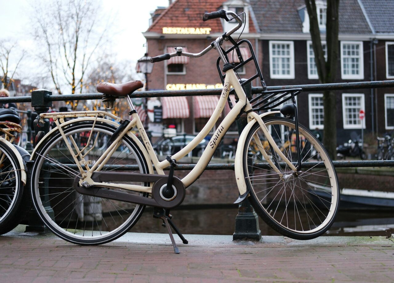 Cream bicycle next to a canal in the Netherlands