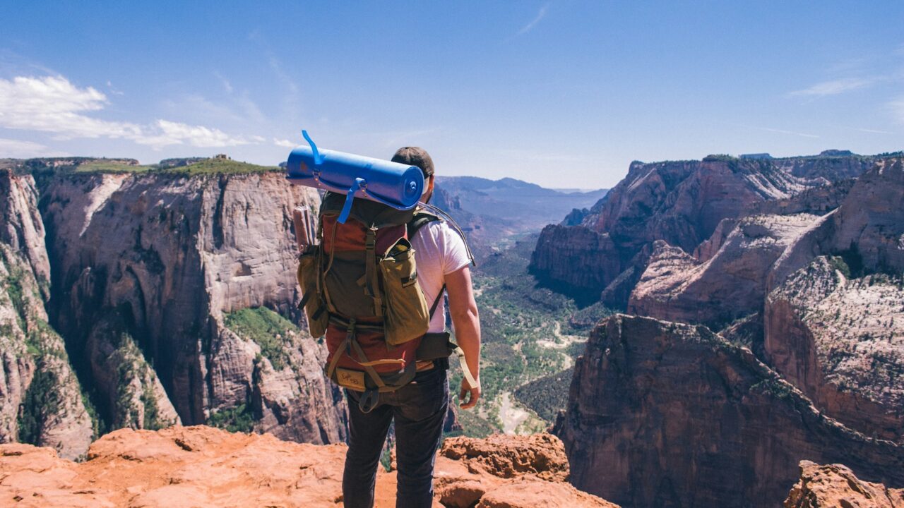 Backpacker overlooking zion canyon
