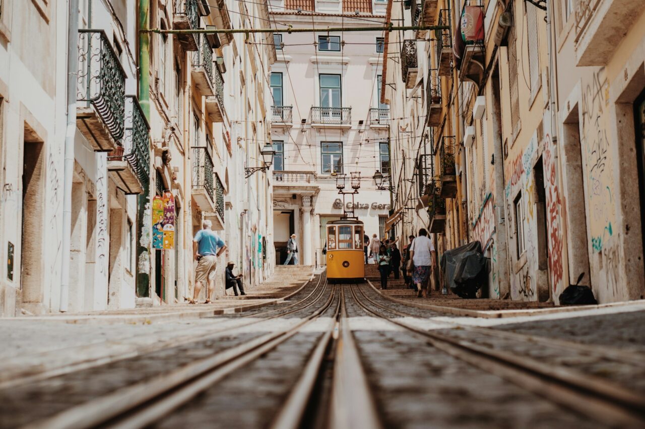 Yellow tram on a street in Lisbon