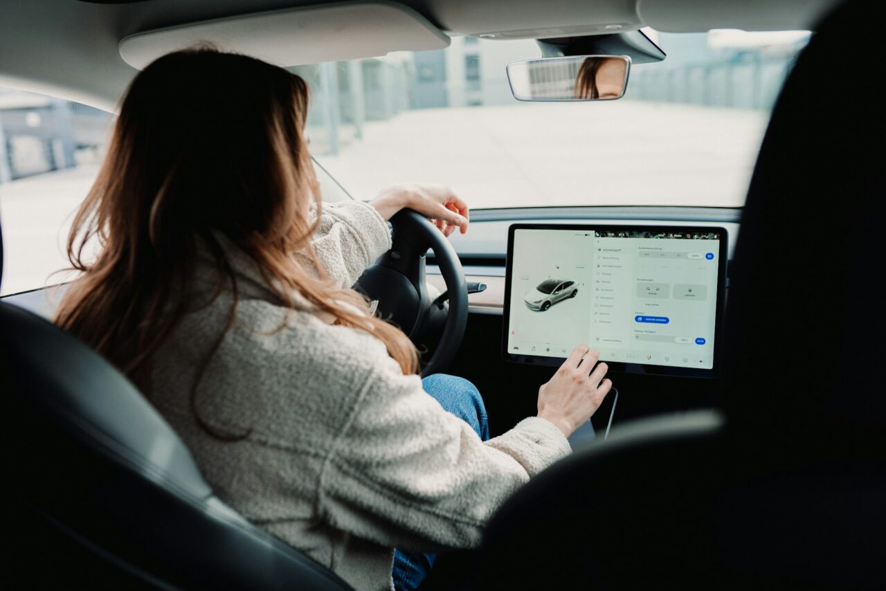 Woman driving a Tesla