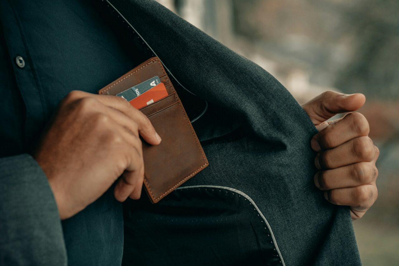 Man putting wallet into his pocket