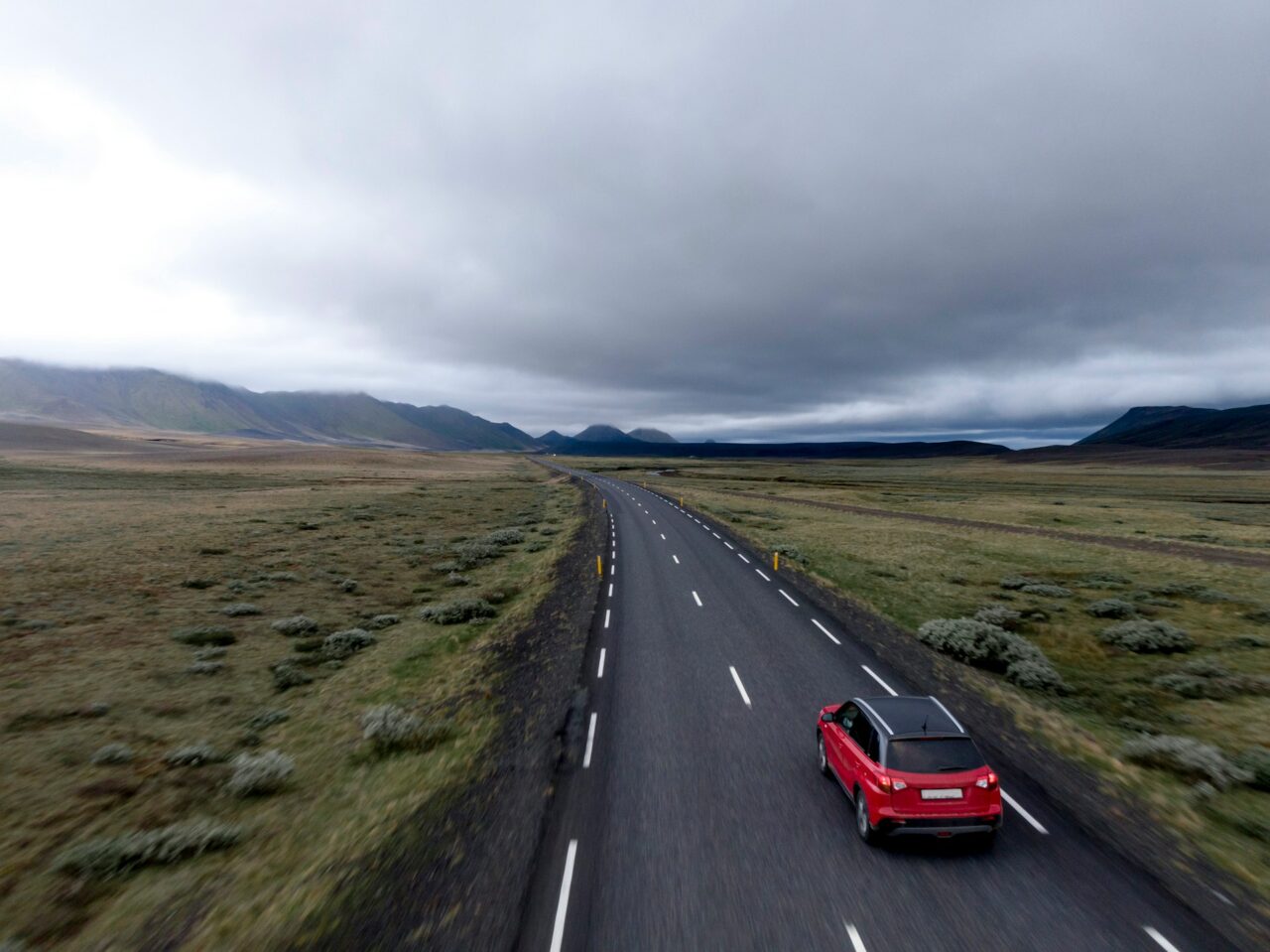 Red car on a country road