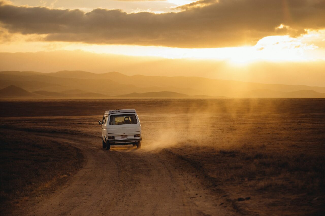 White van on a dusty road