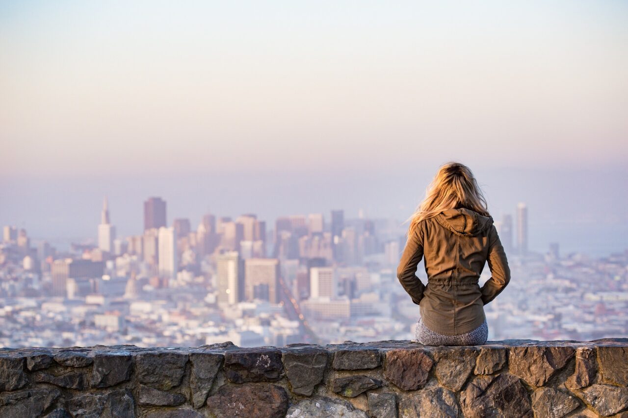 Woman facing a cityscape