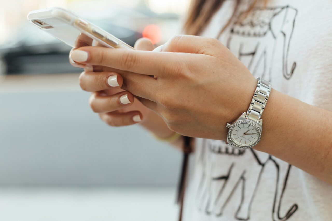 Woman's hands using a phone