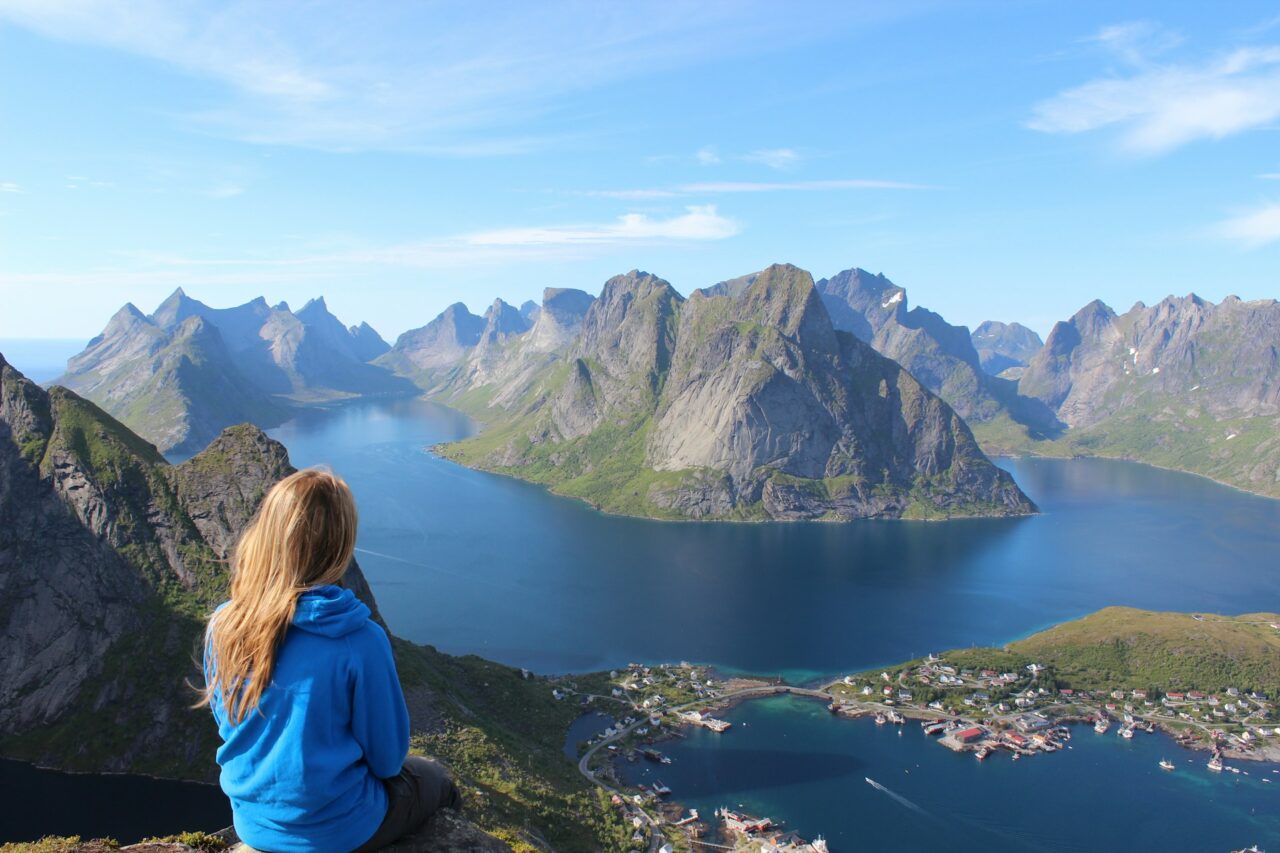 Woman looking out at a scenic view of a lake