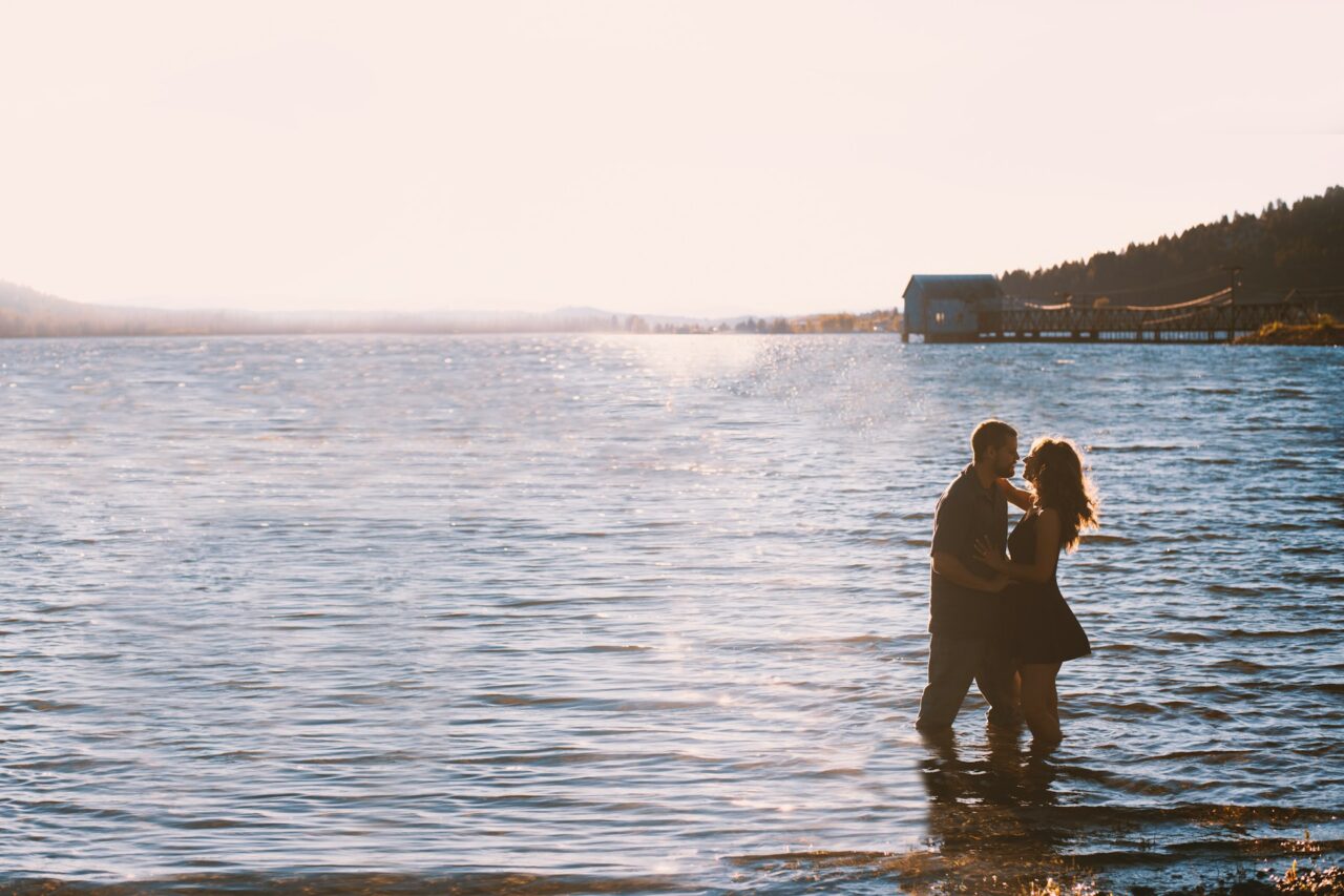 Couple standing in a lake in Montana