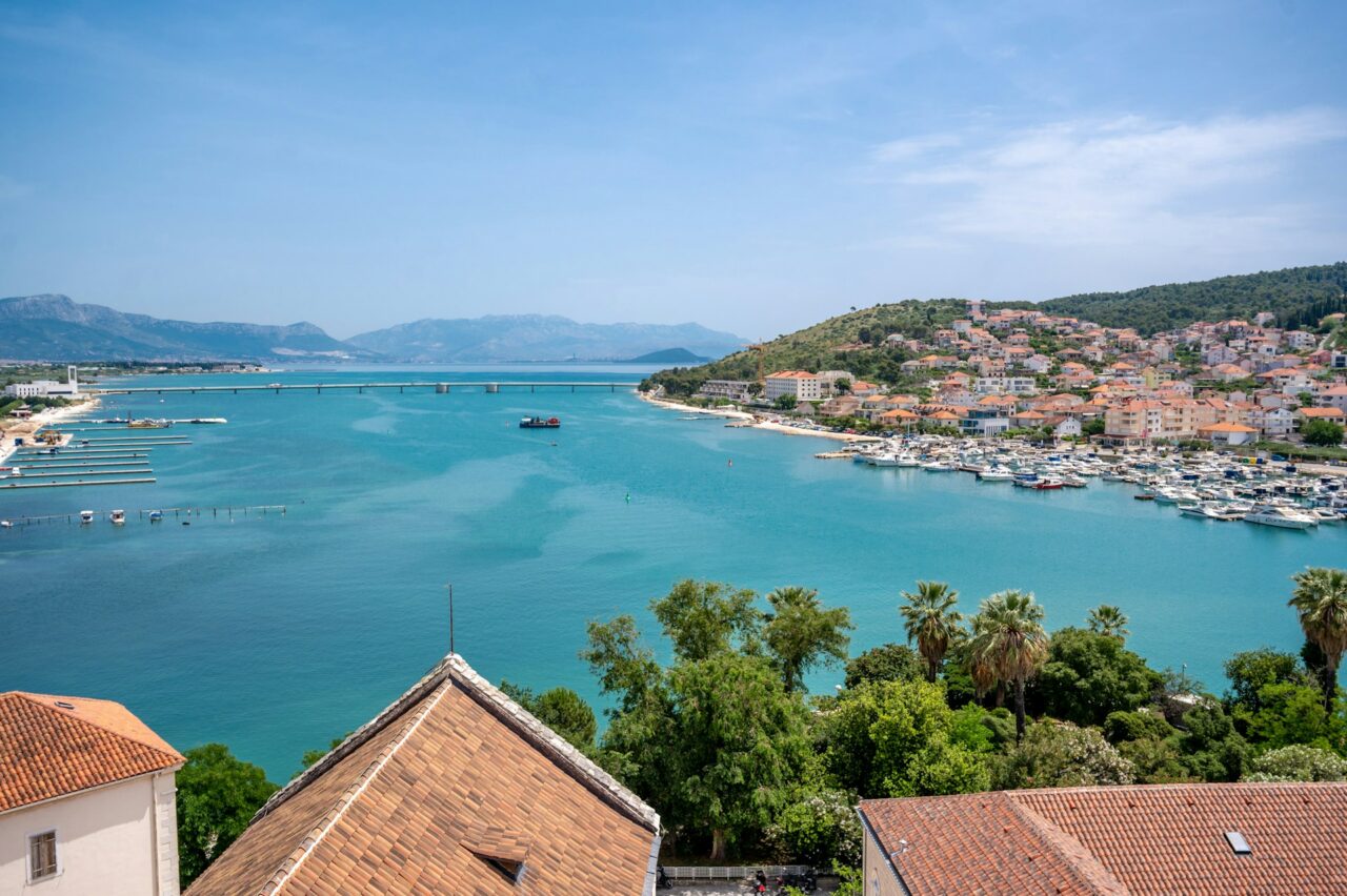 Turquoise blue sea and terra-cotta rooftops in Trogir, Croatia