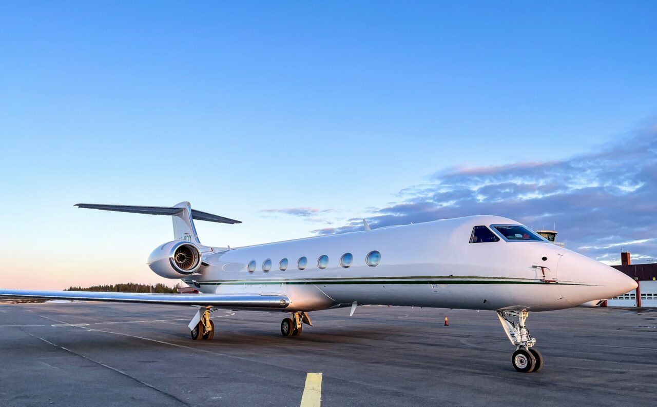 Private jet on a runway at dawn