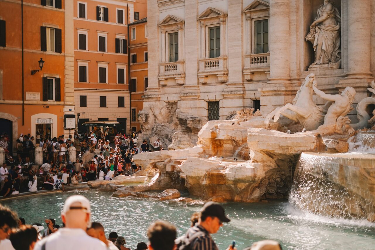 Trevi fountain surrounded by crowds