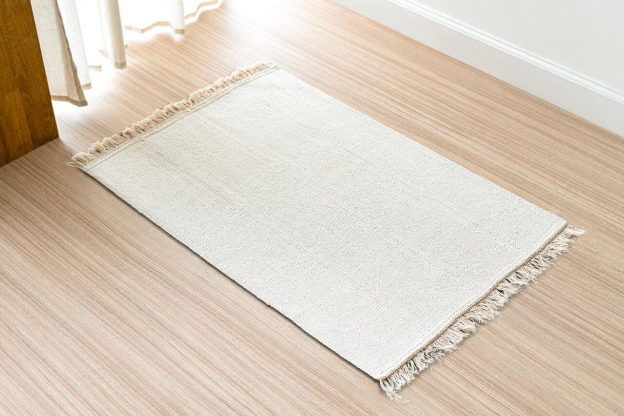 White jute rug on a hardwood floor
