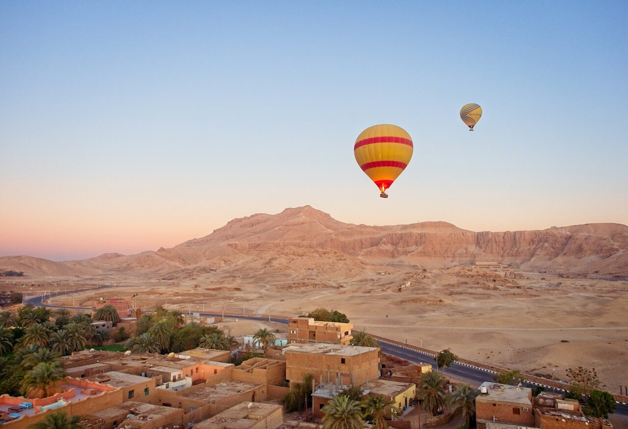 Hot air balloon flying over the desert in Egypt