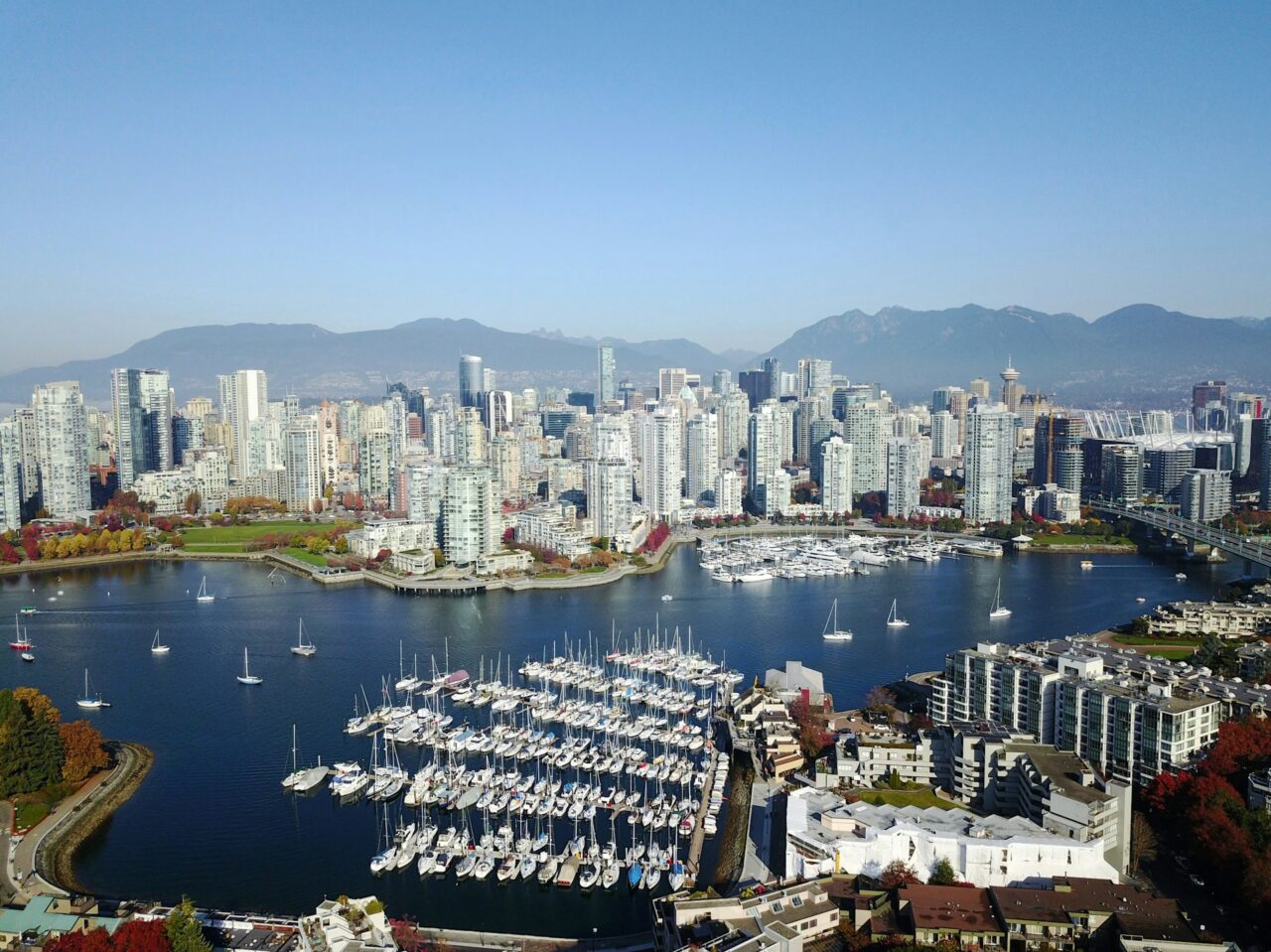 Aerial view of Vancouver during the daytime with buildings, water and boats