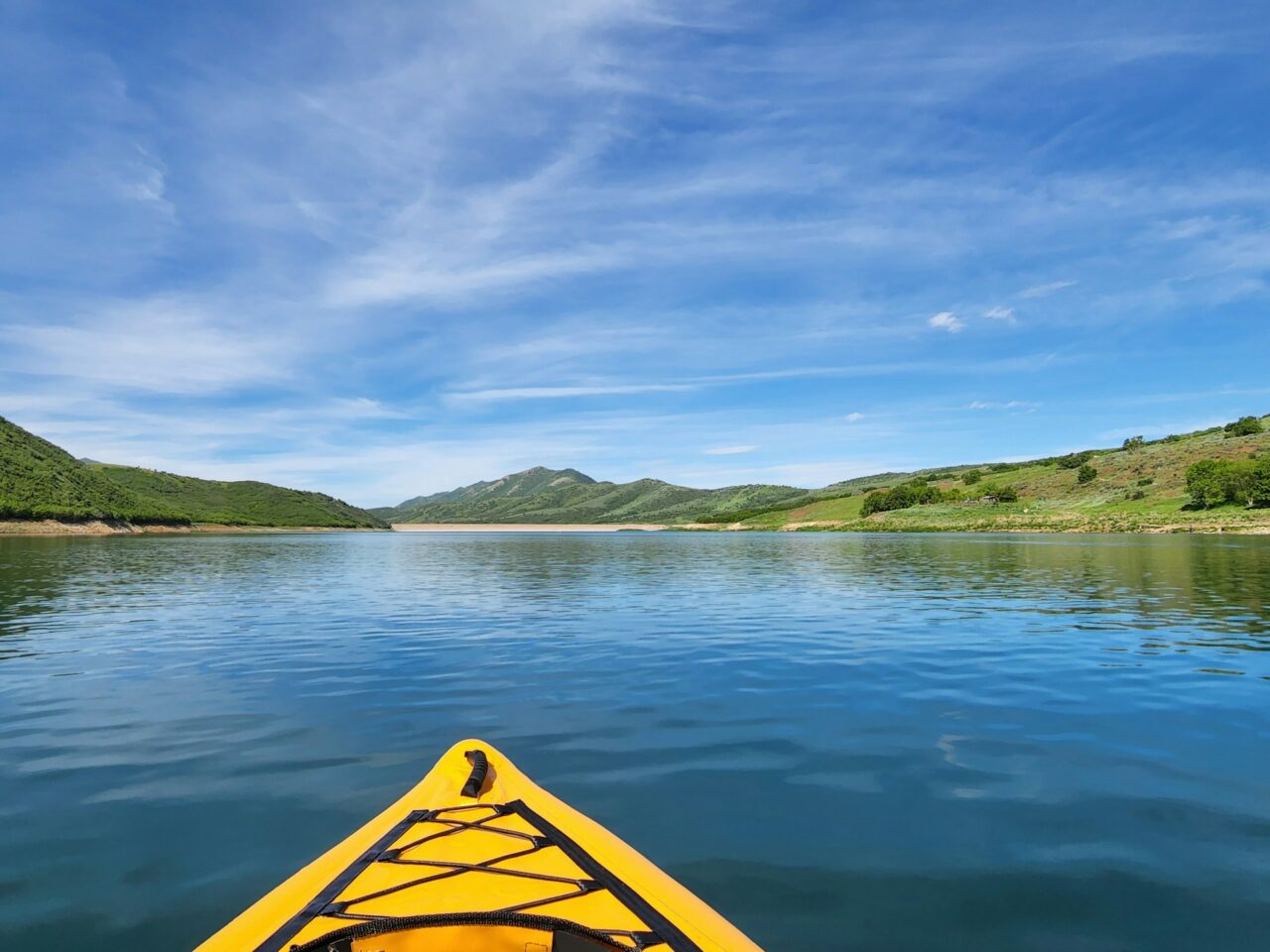 Yellow inflatable kayak on the water